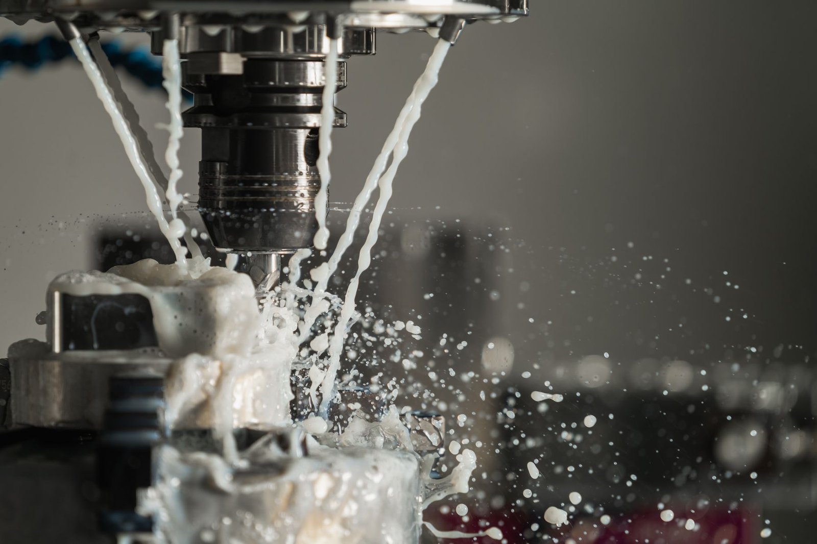 A CNC machine cutting metal under coolant